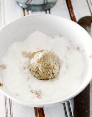 rolling the dough balls in sugar