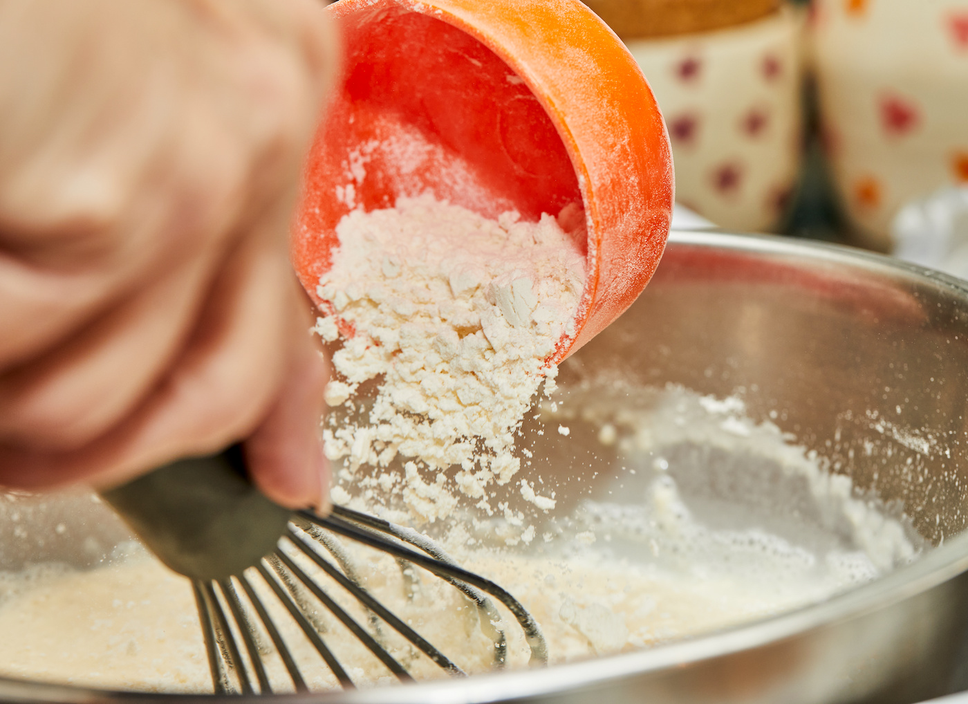 Adding-dry-ingredients-to-wet-batter