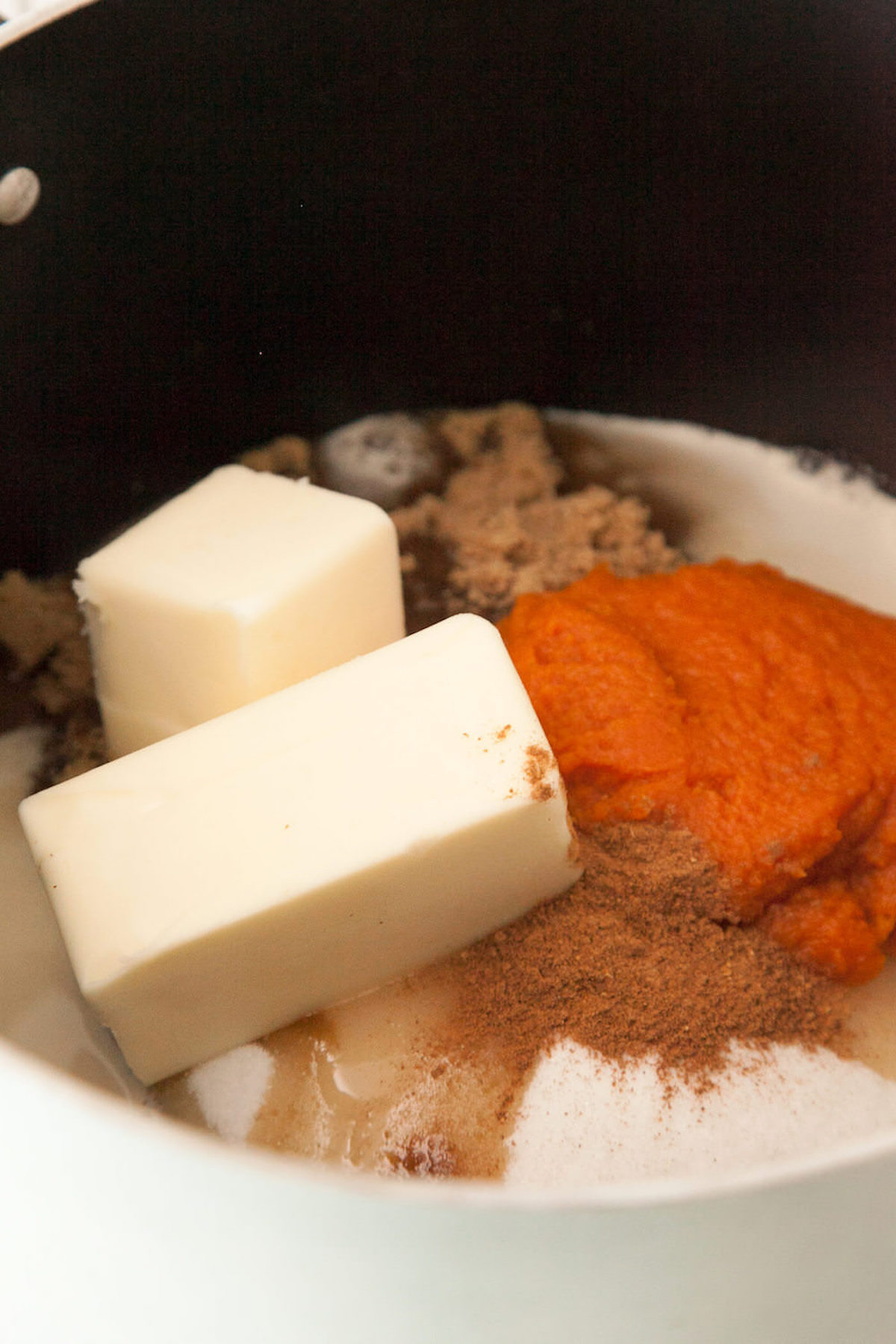Combine sugar, brown sugar, evaporated milk, pumpkin, butter, salt, and spice in a medium saucepan