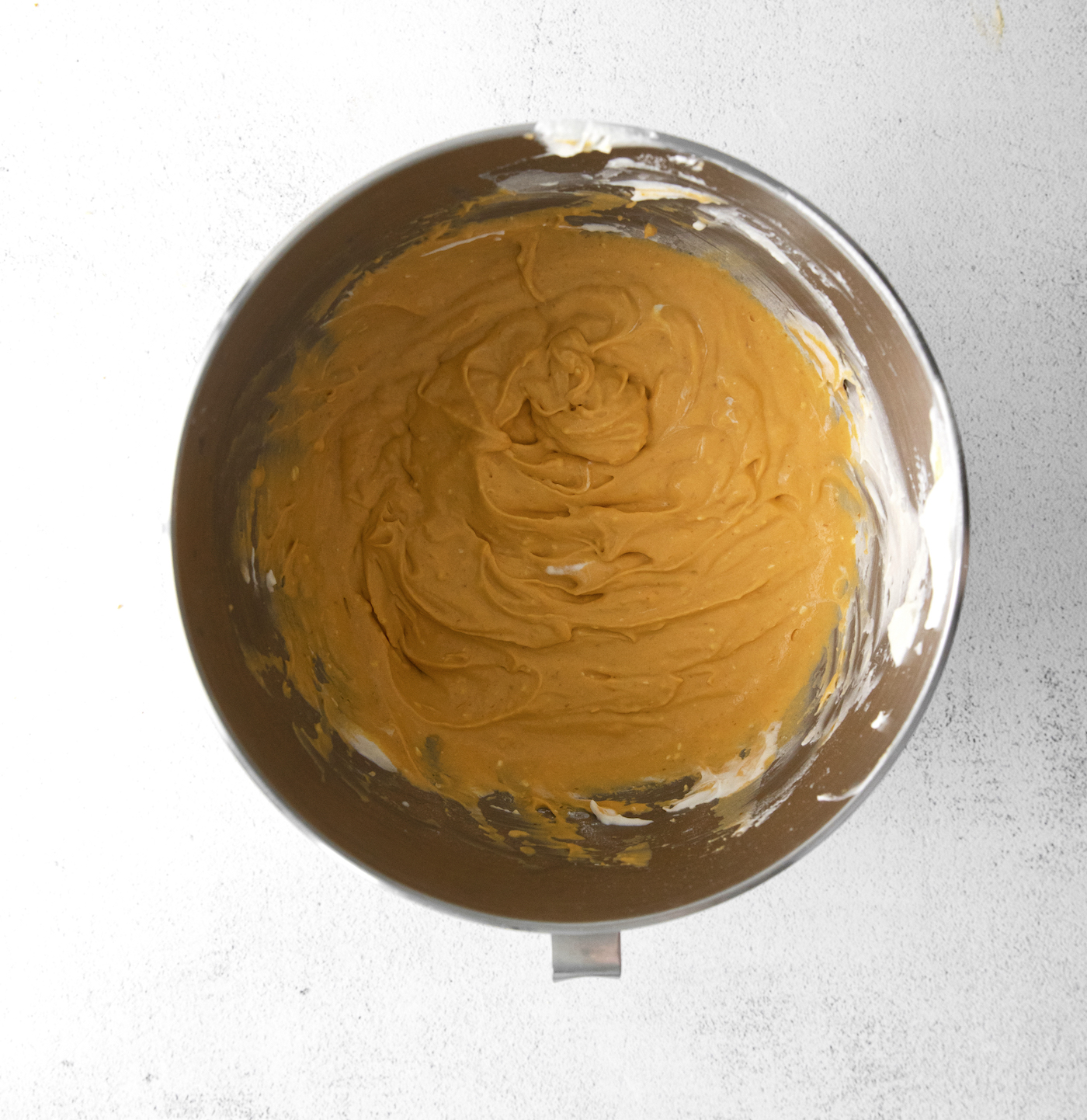 Pumpkin puree and cream cheese whipped together in a bowl