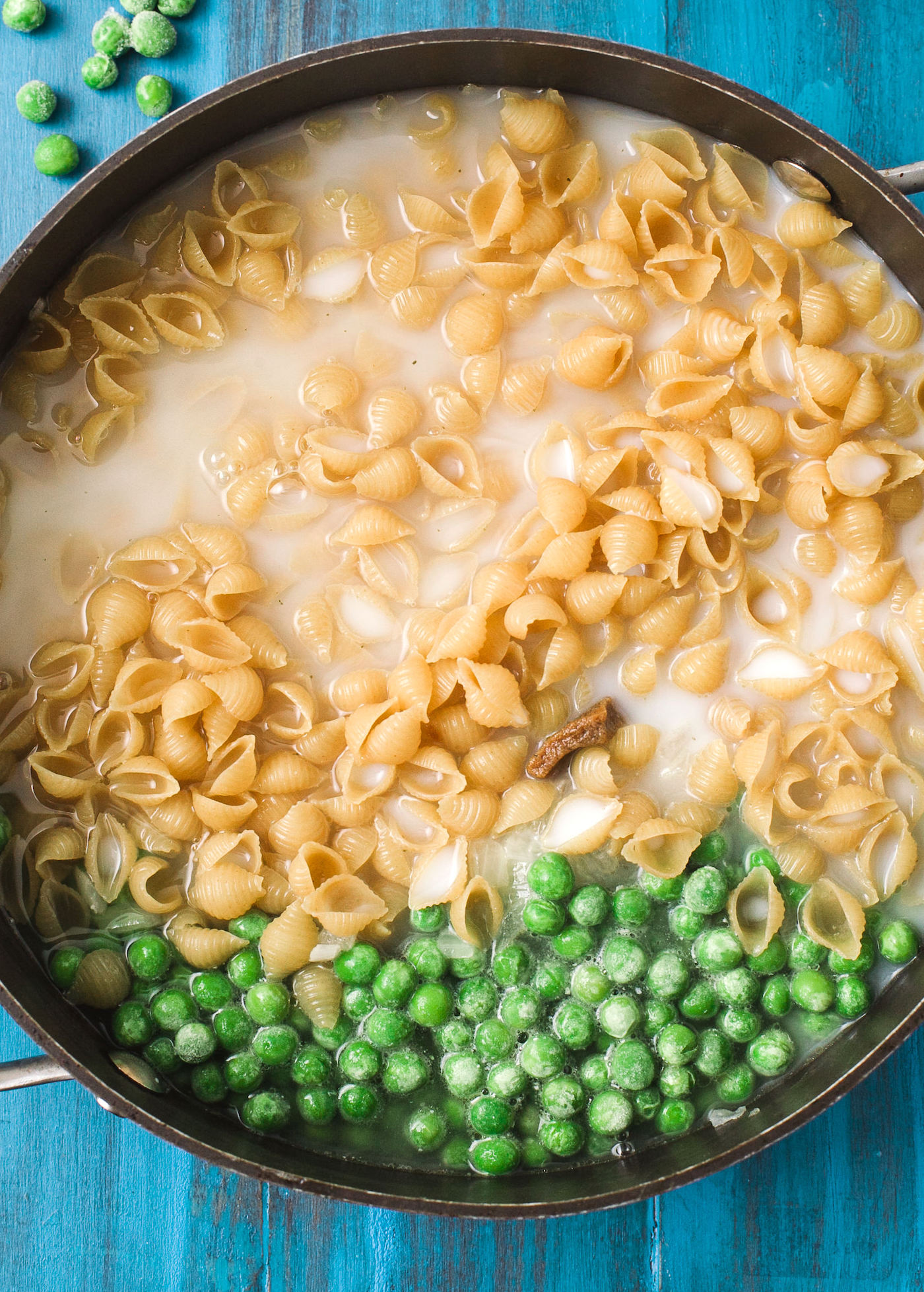 Add the pasta and peas to the pan
