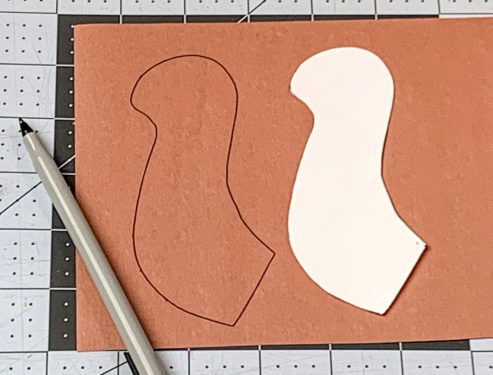 Head piece traced onto brown construction paper with a pen
