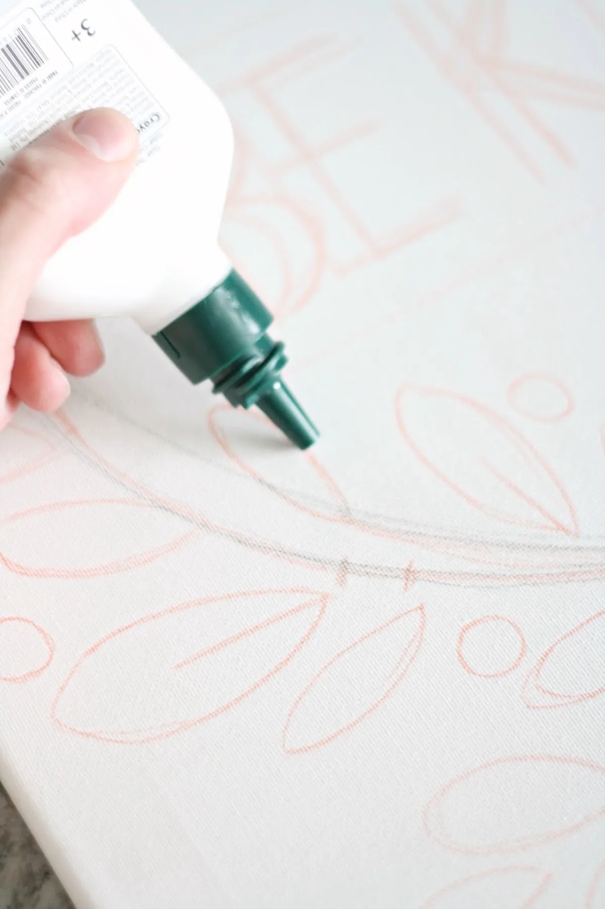 Tracing the pencil lines with washable glue