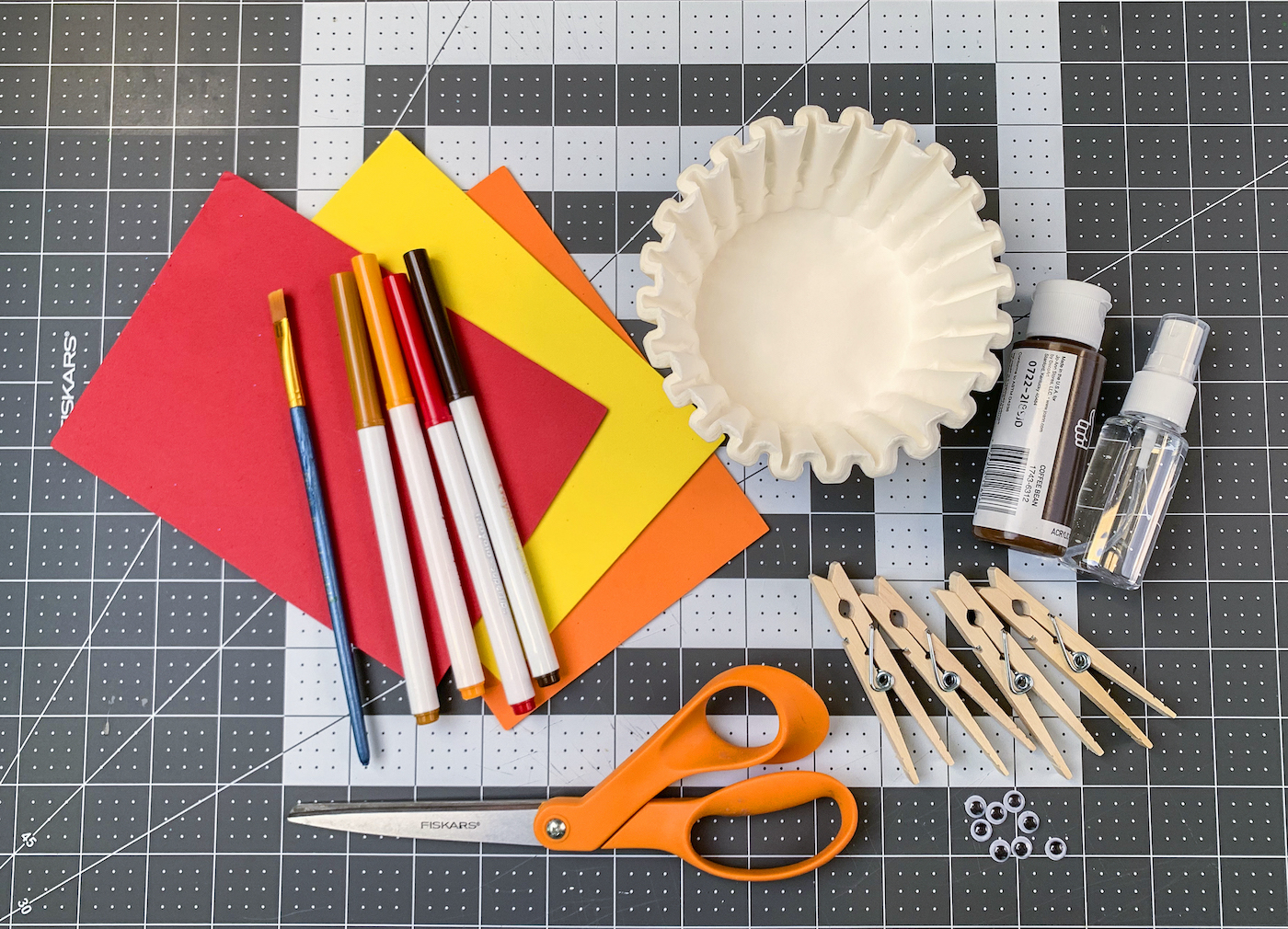 Coffee filters, craft foam, washable markers, clothespins, scissors, googly eyes, paintbrush