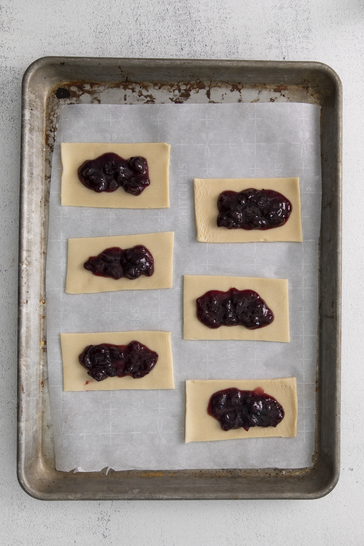 Jam added to the top of the pastry dough