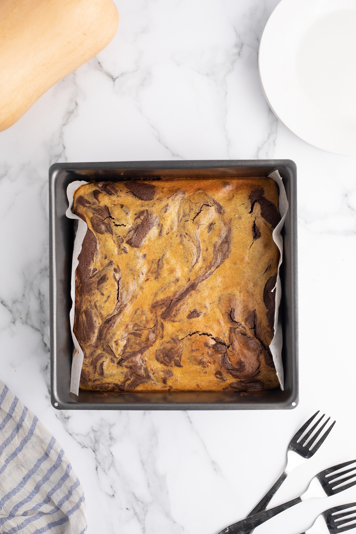 Pumpkin cheesecake brownie recipe in a pan