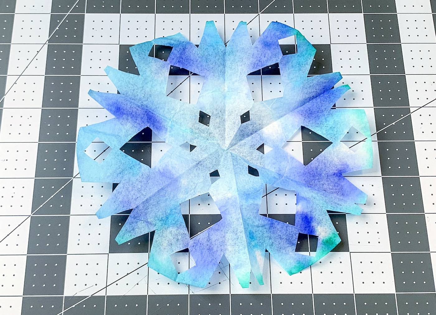 Coffee filter cut into a snowflake