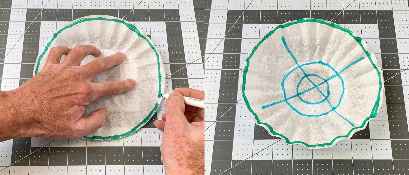 Drawing a green line around the edge of a coffee filter with a marker