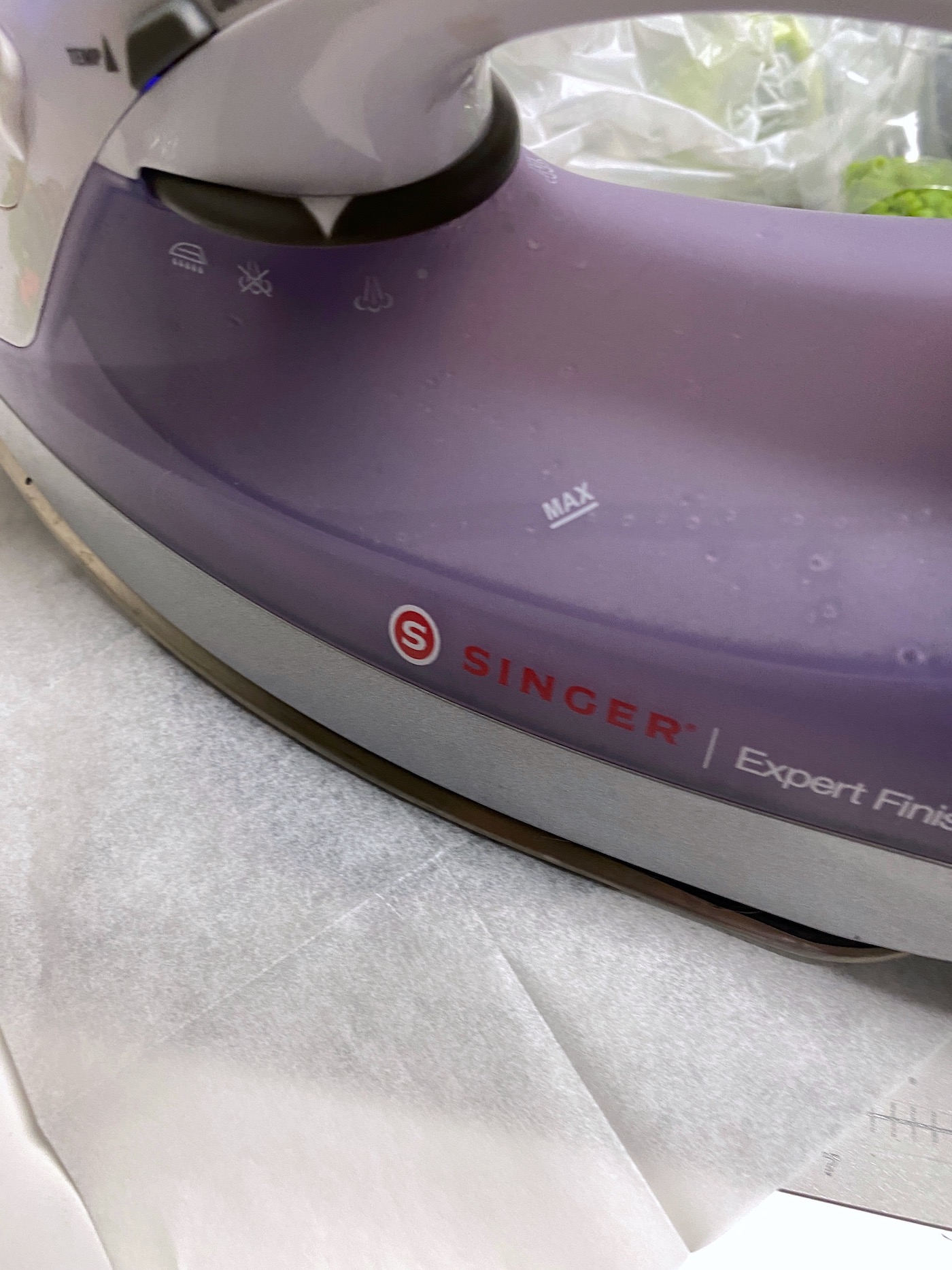 Ironing the parchment paper with an iron