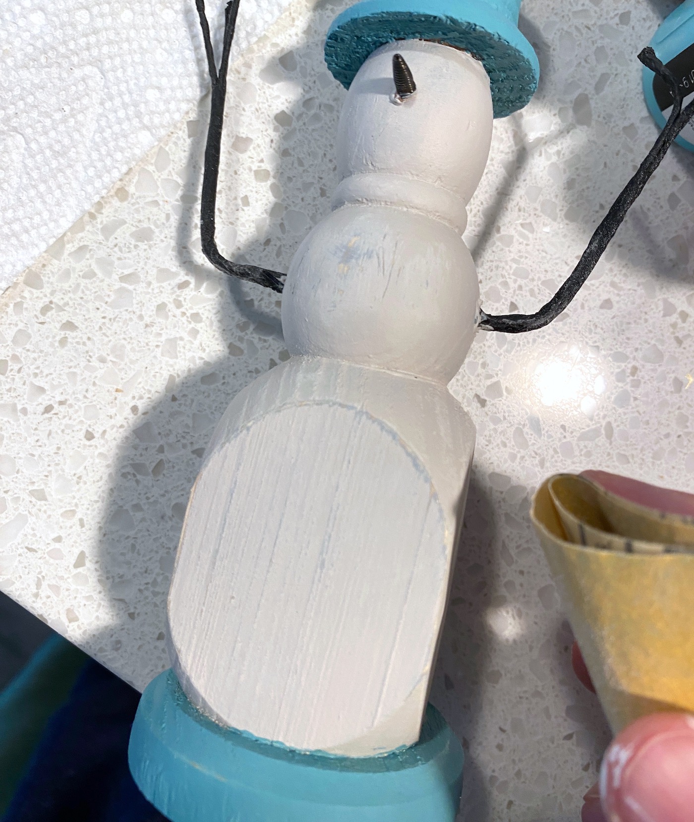 Sanding the candle holder to distress