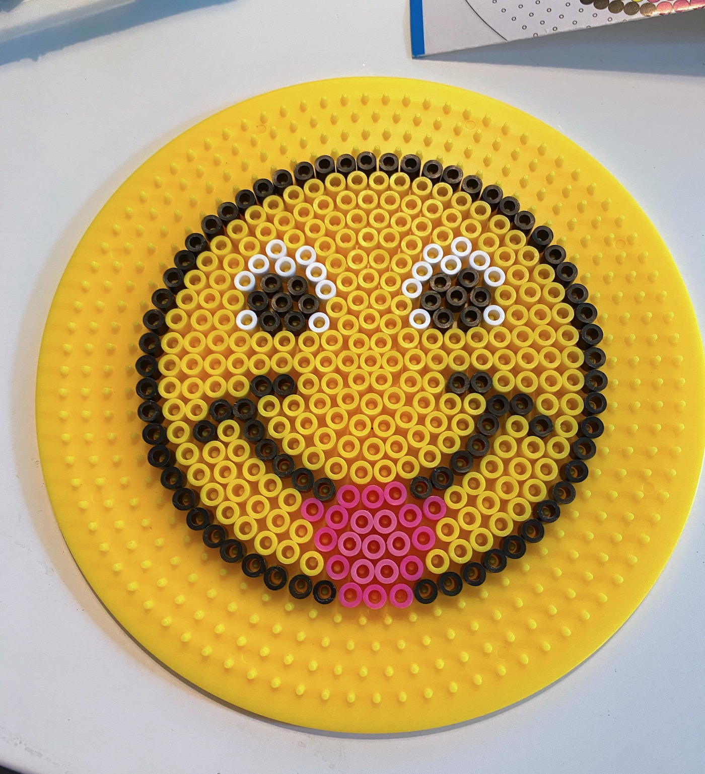 Finished perler bead pattern on a pegboard