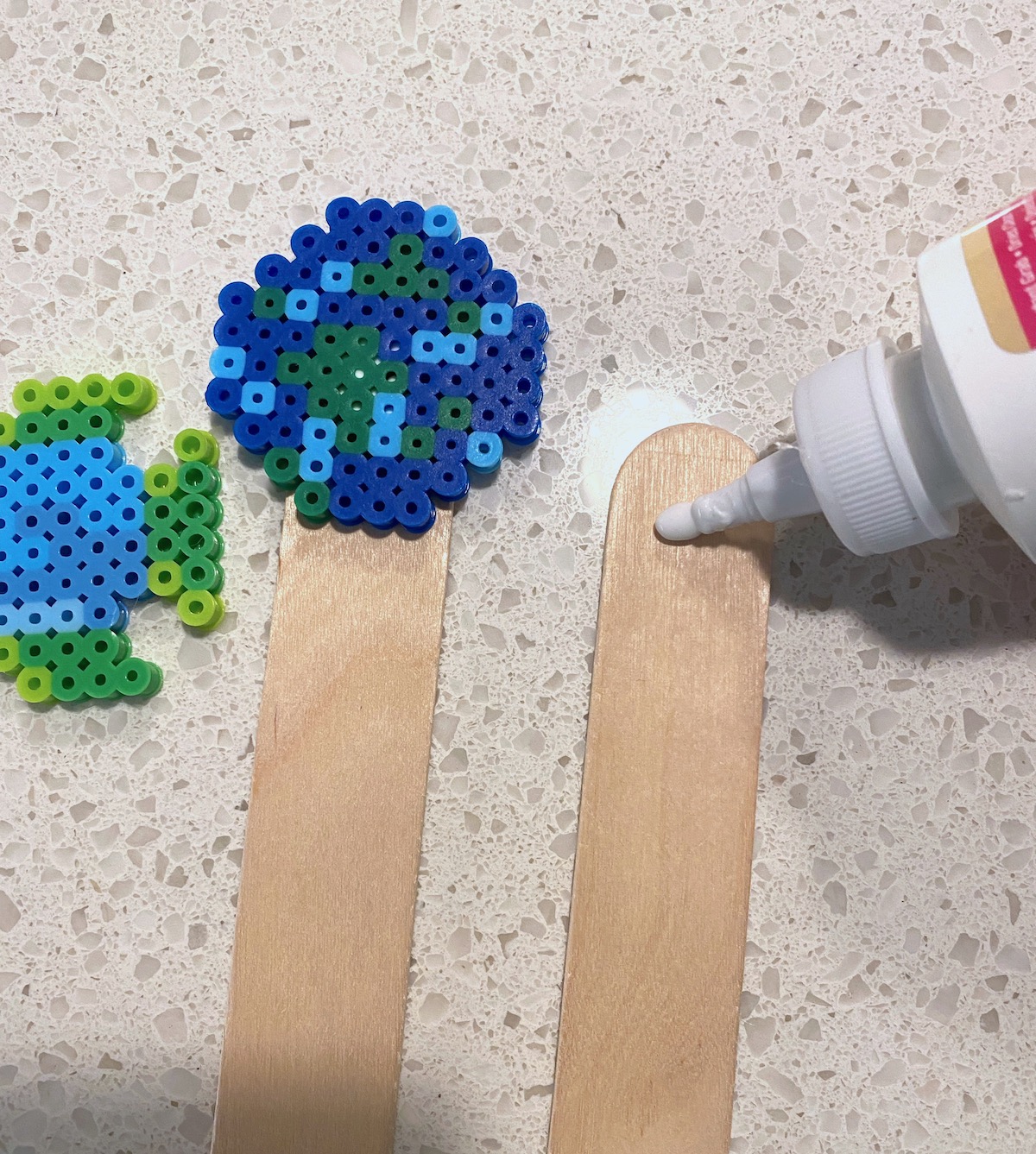 gluing-perler-beads-to-popsicle-sticks