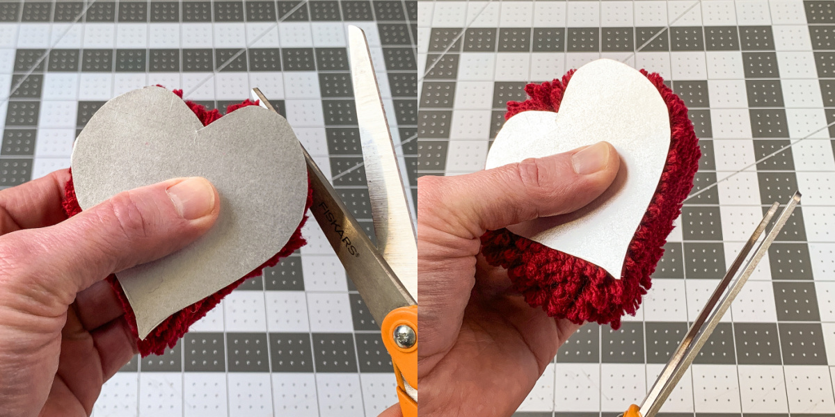 Cutting around the heart template with scissors
