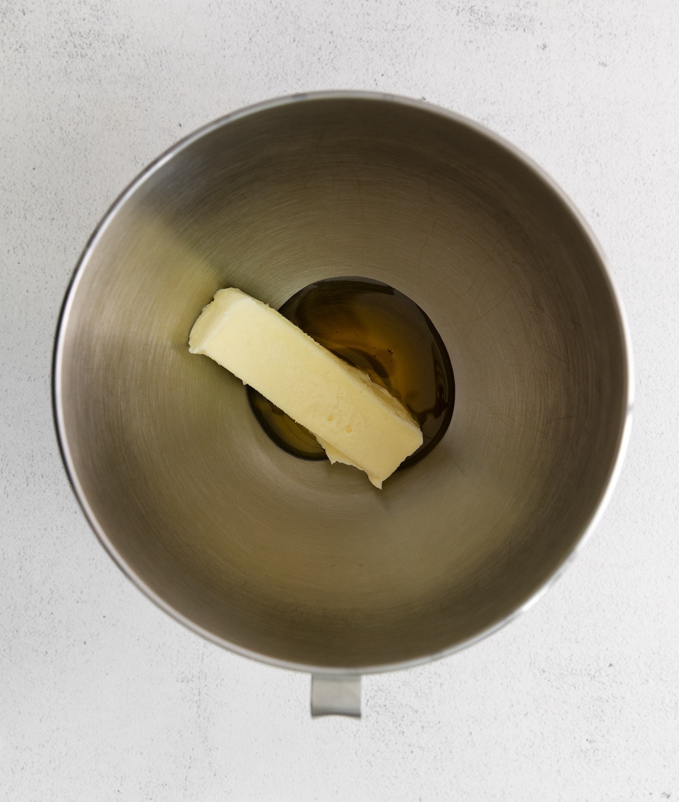 Softened butter and honey in a bowl