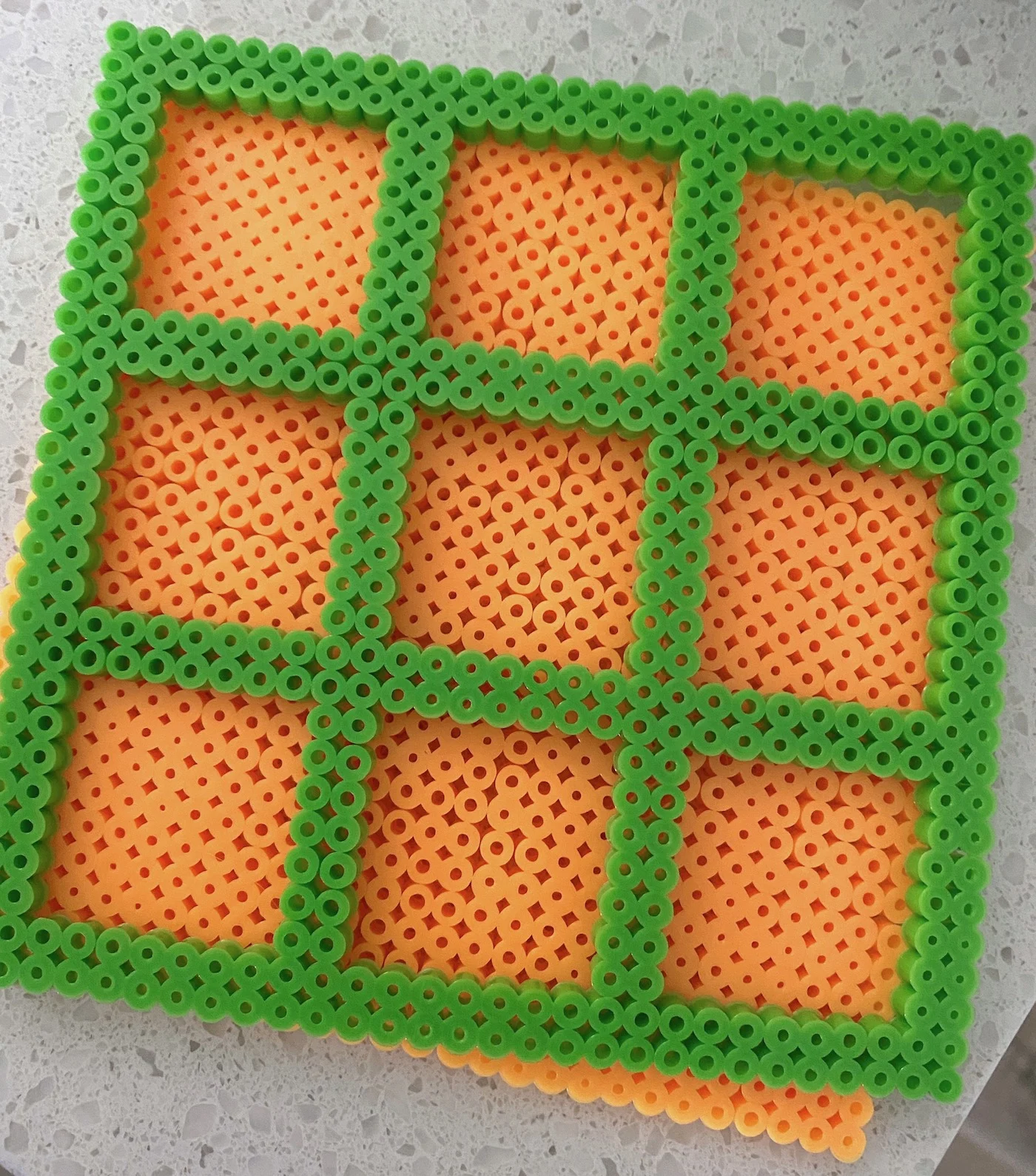 layered perler bead pieces for tic tac toe