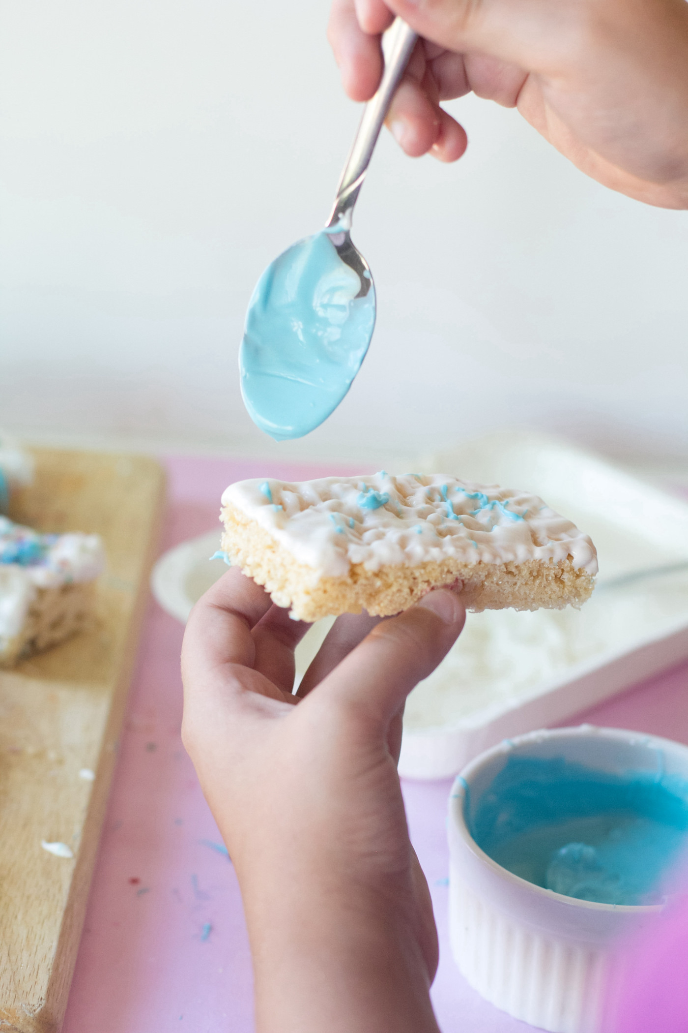 Drizzling candy melts onto the rice krispie bars