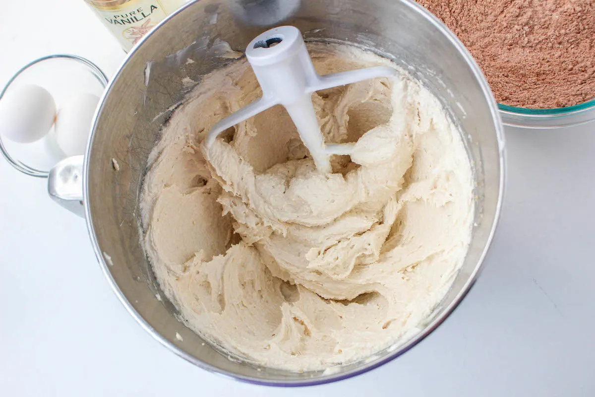 beating the butter mixture with sugars, eggs, and vanilla
