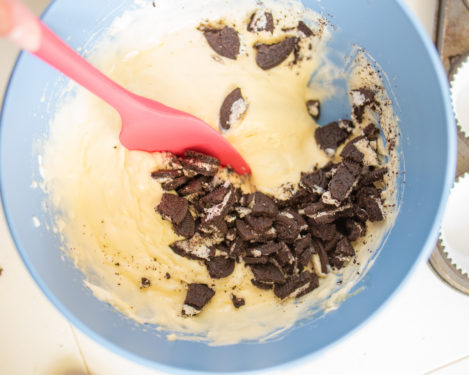 Adding the chopped Oreos to the batter