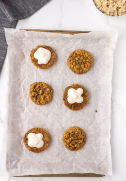 Cream filling on top of the oatmeal cookies