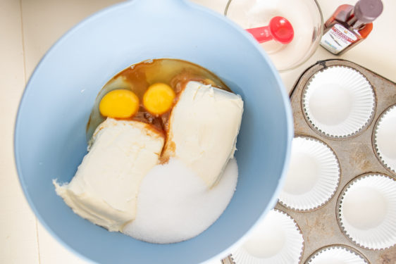 Eggs, cream cheese, sugar, and vanilla extract in a bowl