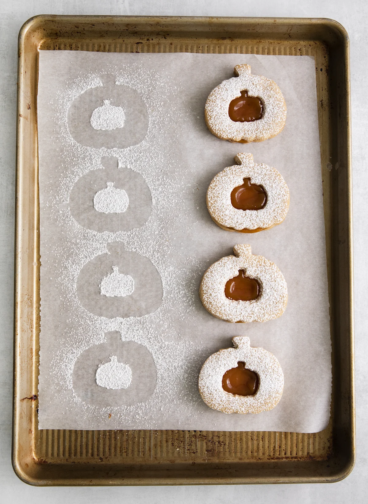 Tops placed onto the bottoms of the pumpkin shortbread cookies