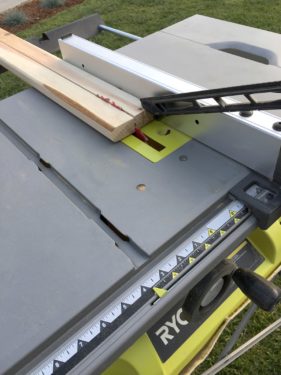 Feeding the cedar planking through the table saw