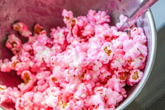 Candy mixture poured over the popcorn