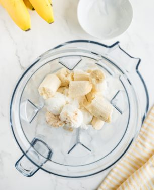 Bananas and other ingredients added to a blender