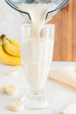 Pouring milkshake into a glass