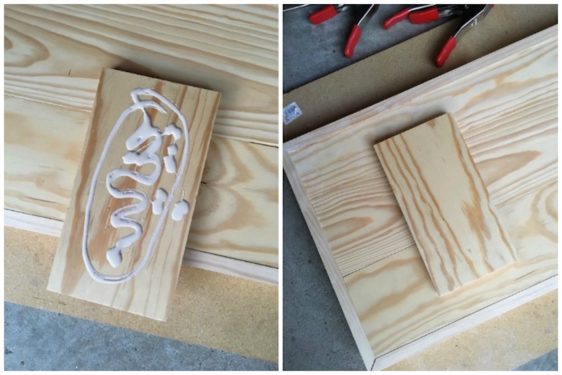 Applying wood glue to the bottom of a wood rectangle and applying to the bench bottom