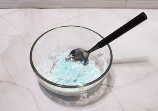 combining cornstarch and dishwashing liquid in a bowl