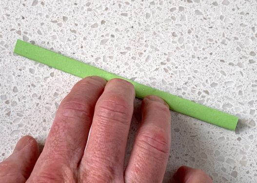 strip of origami paper folded four times