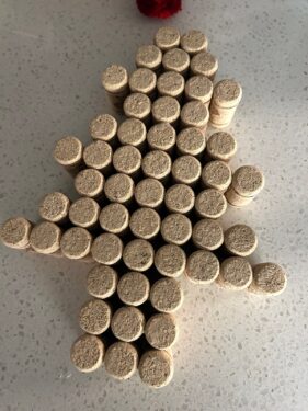 corks laid out on a work surface in the shape of a tree