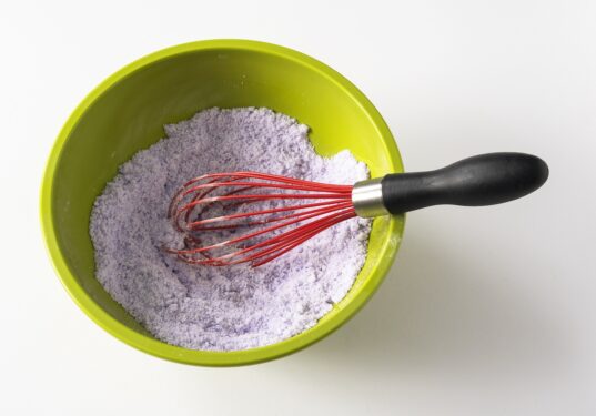 whisking together wet and dry ingredients